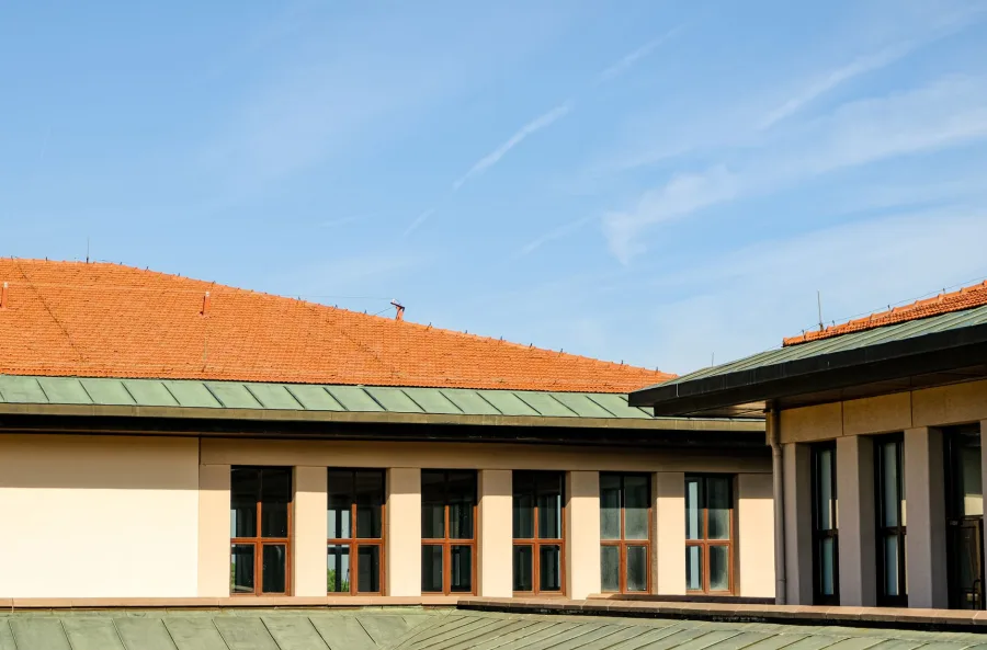 Cypress - Contemporary architecture featuring clean rooflines against a bright blue sky